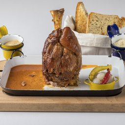 Grilled pork knuckle with mustard and apple horseradish, bread from our oven